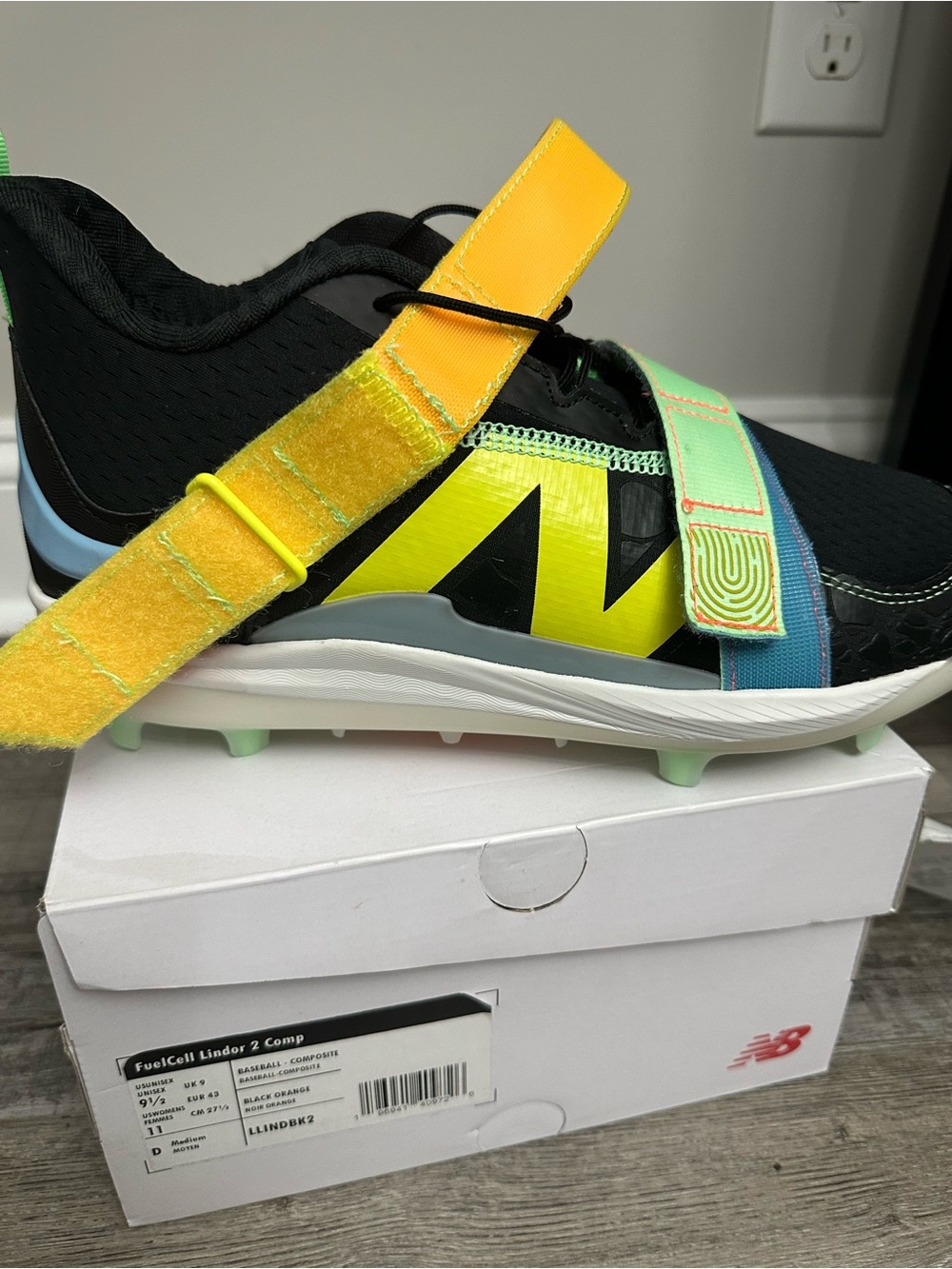 New Balance Kids' Athletic Strap cleats in Black and Neon Yellow molded